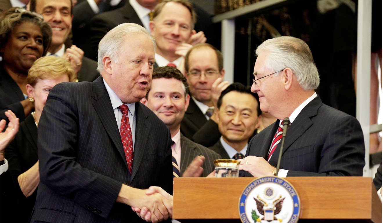 US Secretary of State Rex Tillerson shakes hands with acting US Secretary of State Tom Shannon on February 2. File photo: Reuters