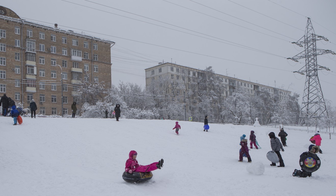 Children toboggan in Moscow on Sunday. Photo: AP