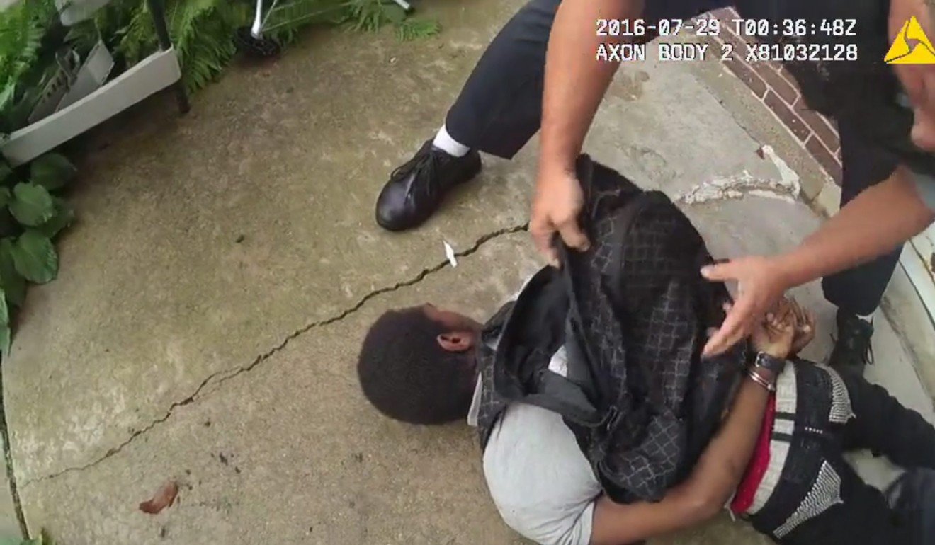 A frame grab taken from a handout body cam video dated 28 July 2016 and made available by Chicago's Independent Police Review Authority (IPRA) shows a police officer searching unarmed detained teenager Paul O'Neal. O’Neal was later shot and killed by police. Photo: EPA