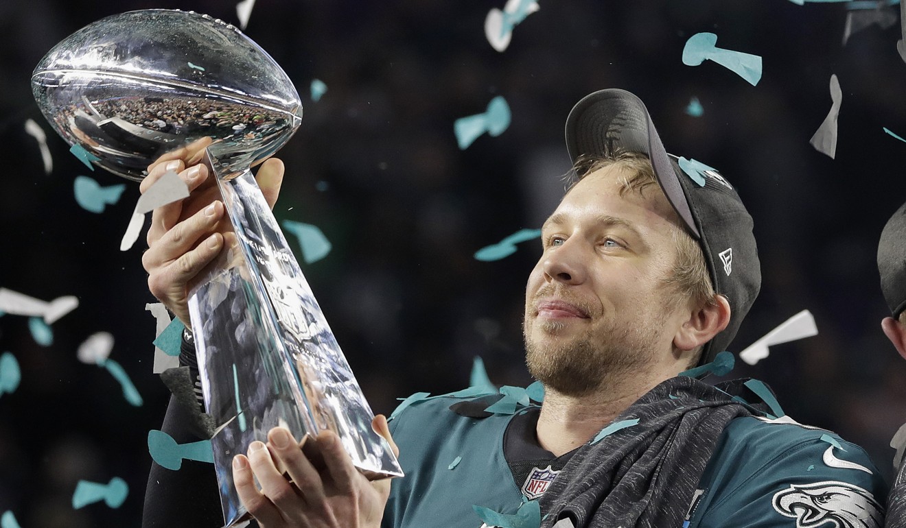 The Eagles’ Nick Foles holds up the Vince Lombardi Trophy. Photo: AP