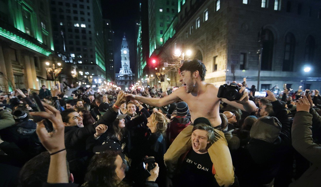 Philadelphia Eagles fans celebrate the team's victory on Sunday. Photo: AP