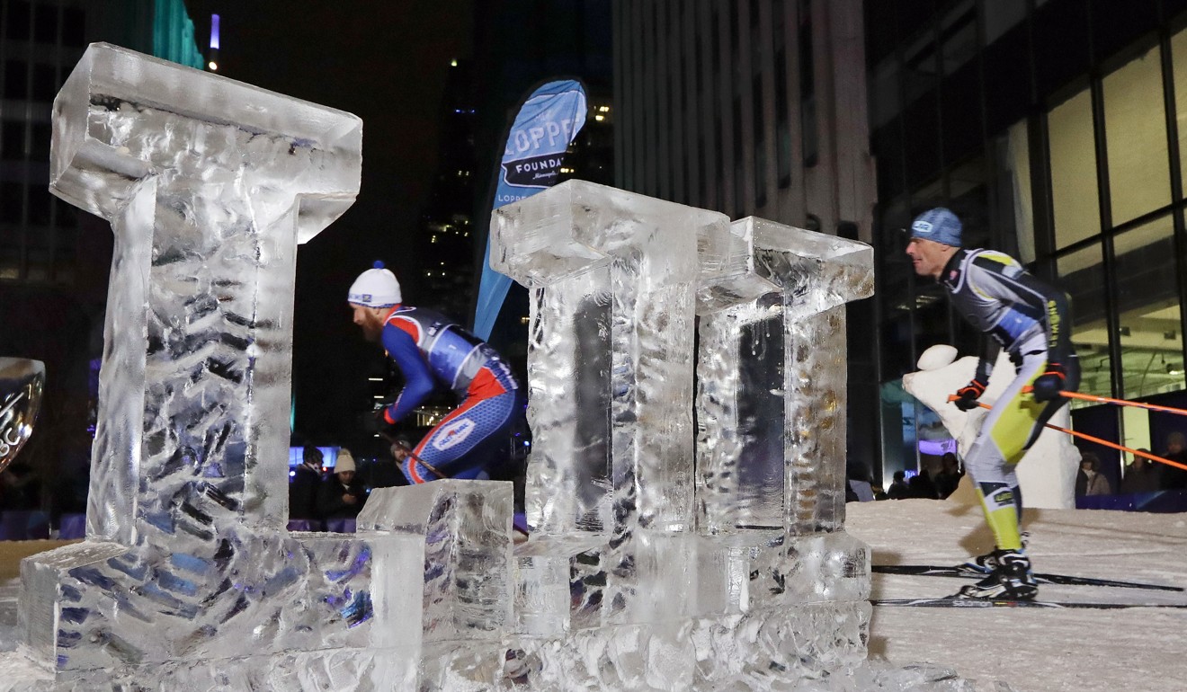 Skiers pass by an ice sculpture of the Roman numeral LII for Super Bowl 52 on a ski run in downtown Minneapolis, Minnesota. Photo: AP