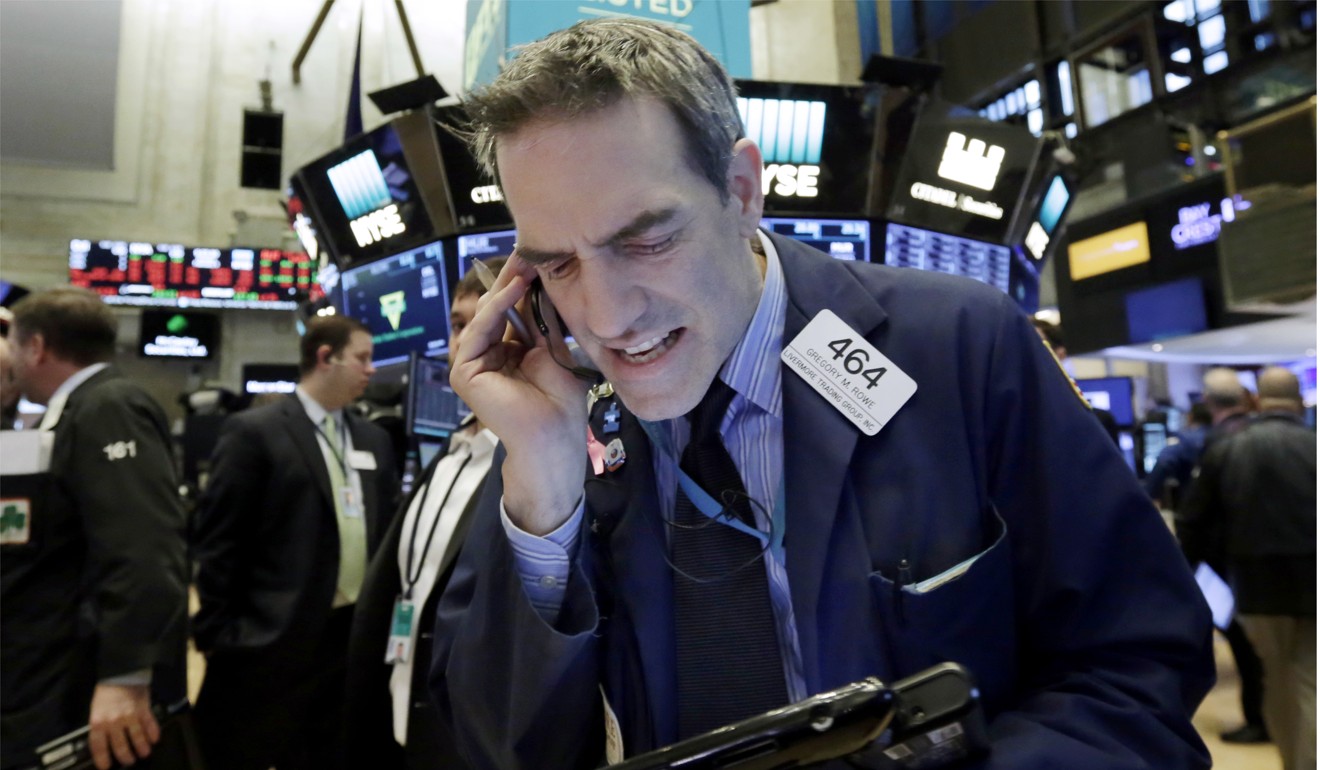 Trader Gregory Rowe works on the floor of the New York Stock Exchange on Monday. Photo: AP