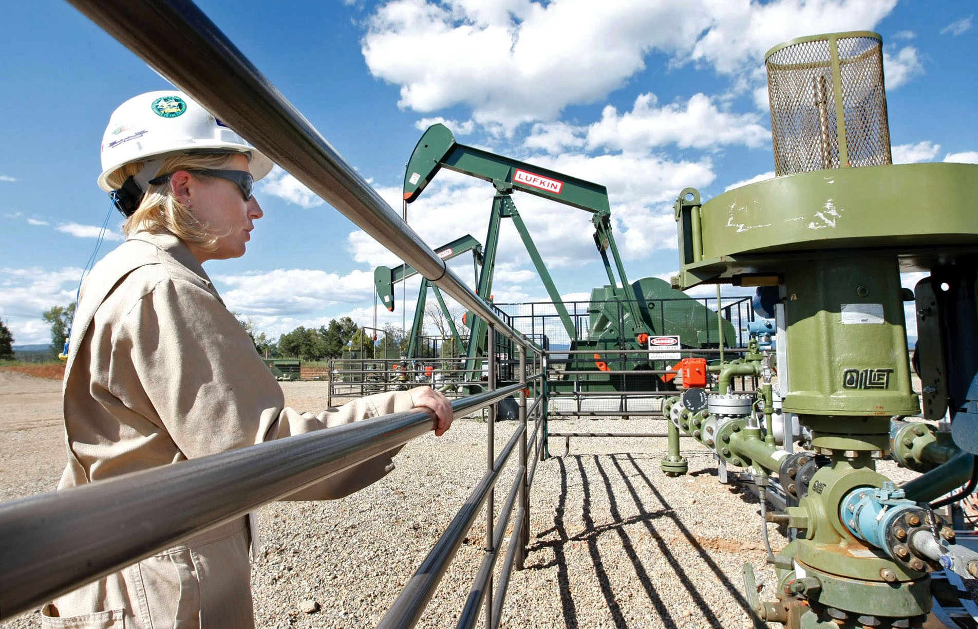 A BP Florida operations manager looks over a methane gas well site, east of Bayfield, Colorado. Reducing or eliminating methane is an under-discussed method for reducing global greenhouse gas emissions and mitigating the effects of climate change. Photo: AP