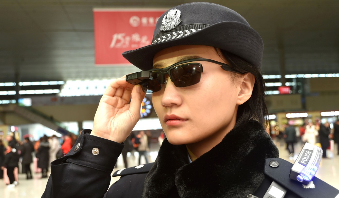 A police officer wears a pair of smart glasses with a facial recognition system at Zhengzhou East Railway Station in Zhengzhou, capital of the central Chinese province of Henan, to spot suspected criminals. Photo: Agence France-Presse