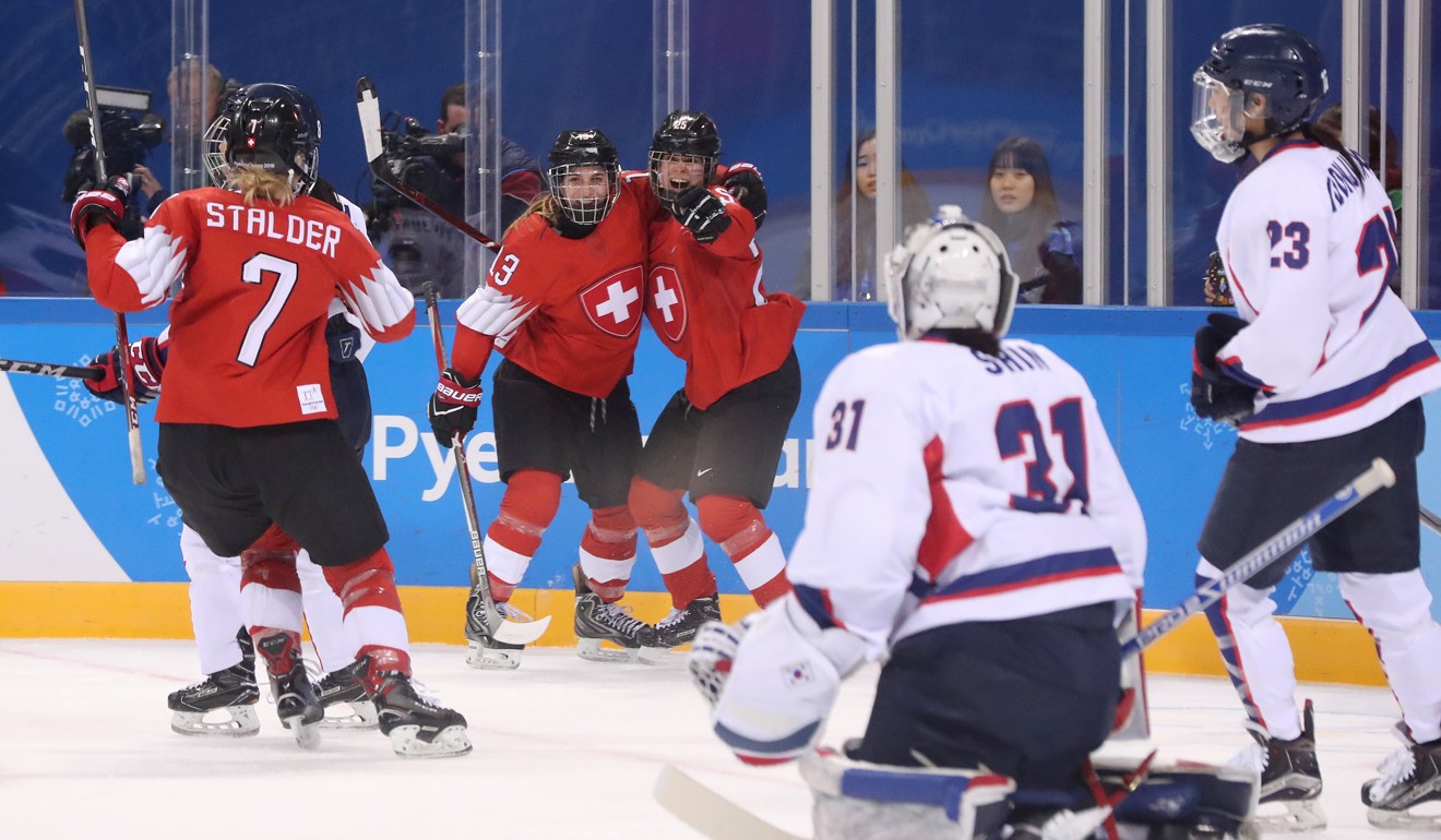 Sara Benz (second from left) and Alina Muller (third from left) of Switzerland celebrate scoring against Korea. Photo: EPA