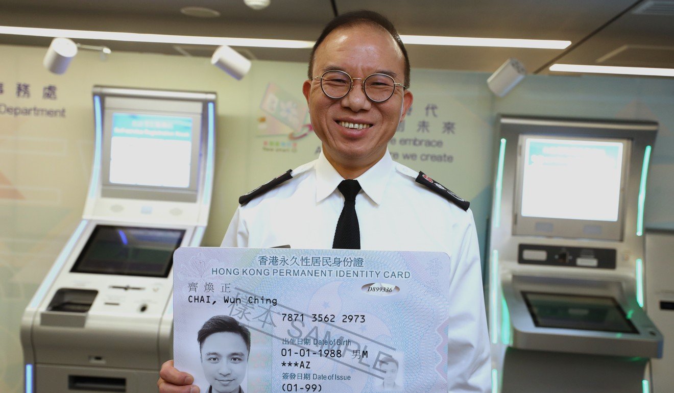 Immigration Department director Erick Tsang presenting a model of the new ID card. Photo: Winson Wong