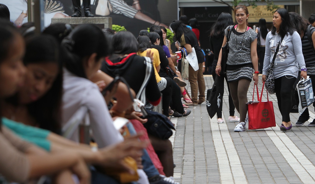 The government requires foreign maids in Hong Kong to live with their employers. Only those who had been living apart before the live-in rule was effected in April 2003 were allowed to continue with the arrangement. Photo: Felix Wong