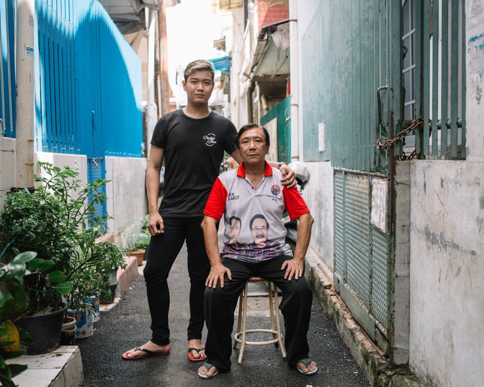 Arifin and his father, Ah Kim, in an alleyway outside their house. Photo: Muhammad Fadli