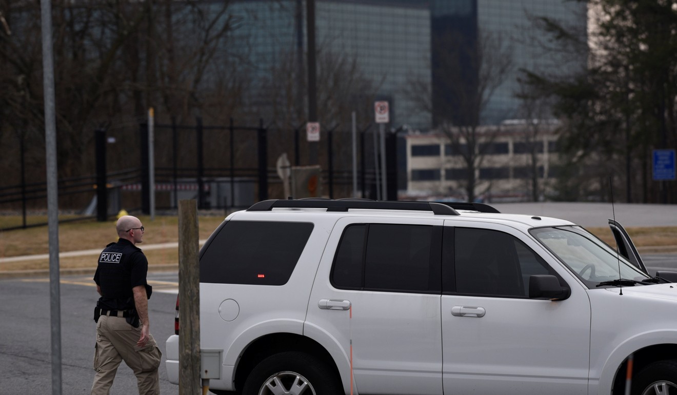 A law enforcement officer walks to his vehicle at the media staging area after a shooting outside the National Security Agency (NSA) headquarters in Fort Meade, Maryland, on February 14, 2018. Photo: Reuters