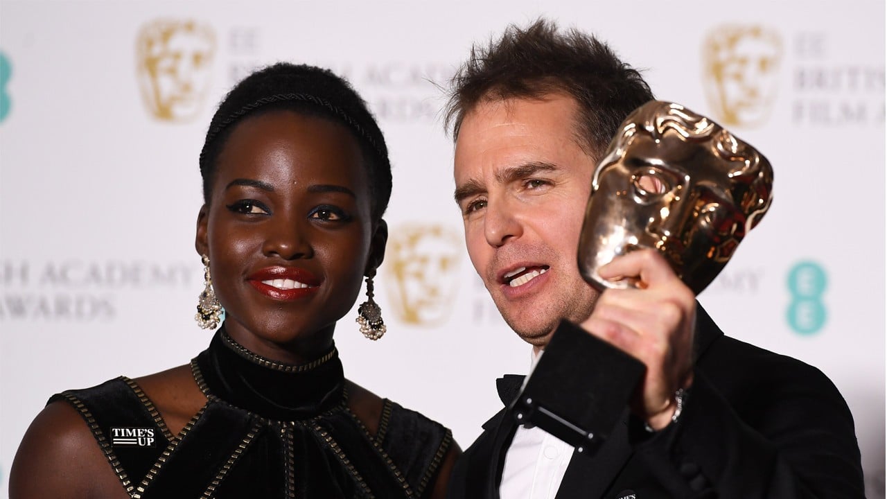 US actor Sam Rockwell (right) poses after winning the BAFTA Award for best supporting actor for ‘Three Billboards outside Ebbing, Missouri’ with Kenyan-Mexican actress Lupita Nyong'o (left). Nyong’o, like many women at the event, wore a black dress to protest sexual harassment. Photo: EPA-EFE