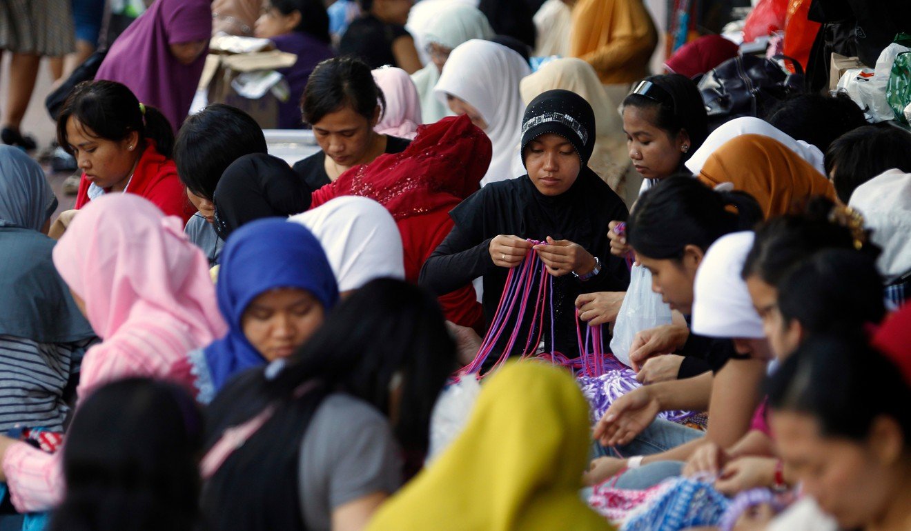 Many domestic helpers don’t get their proper days off. Photo: AFP