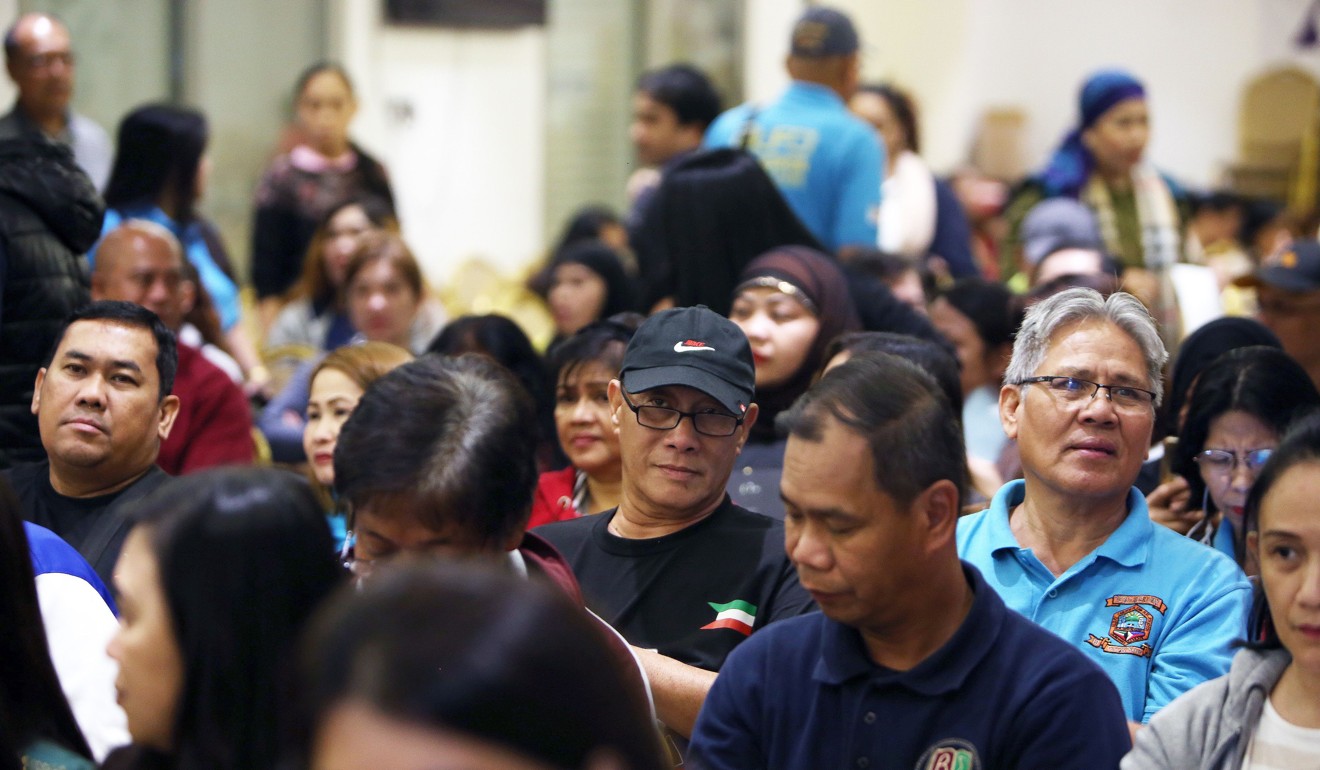 Members of the Filipino community working in Kuwait at the meeting in the embassy. Photo: AFP