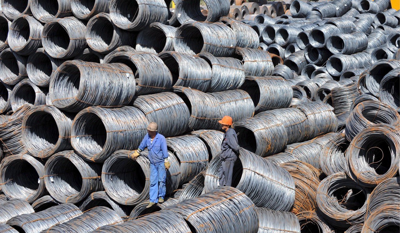 Steel workers in northeast China's Shenyang inspect rolls of the metal. US President Donald Trump announced on March 1 that he would impose harsh tariffs on steel imports. Photo: EPA