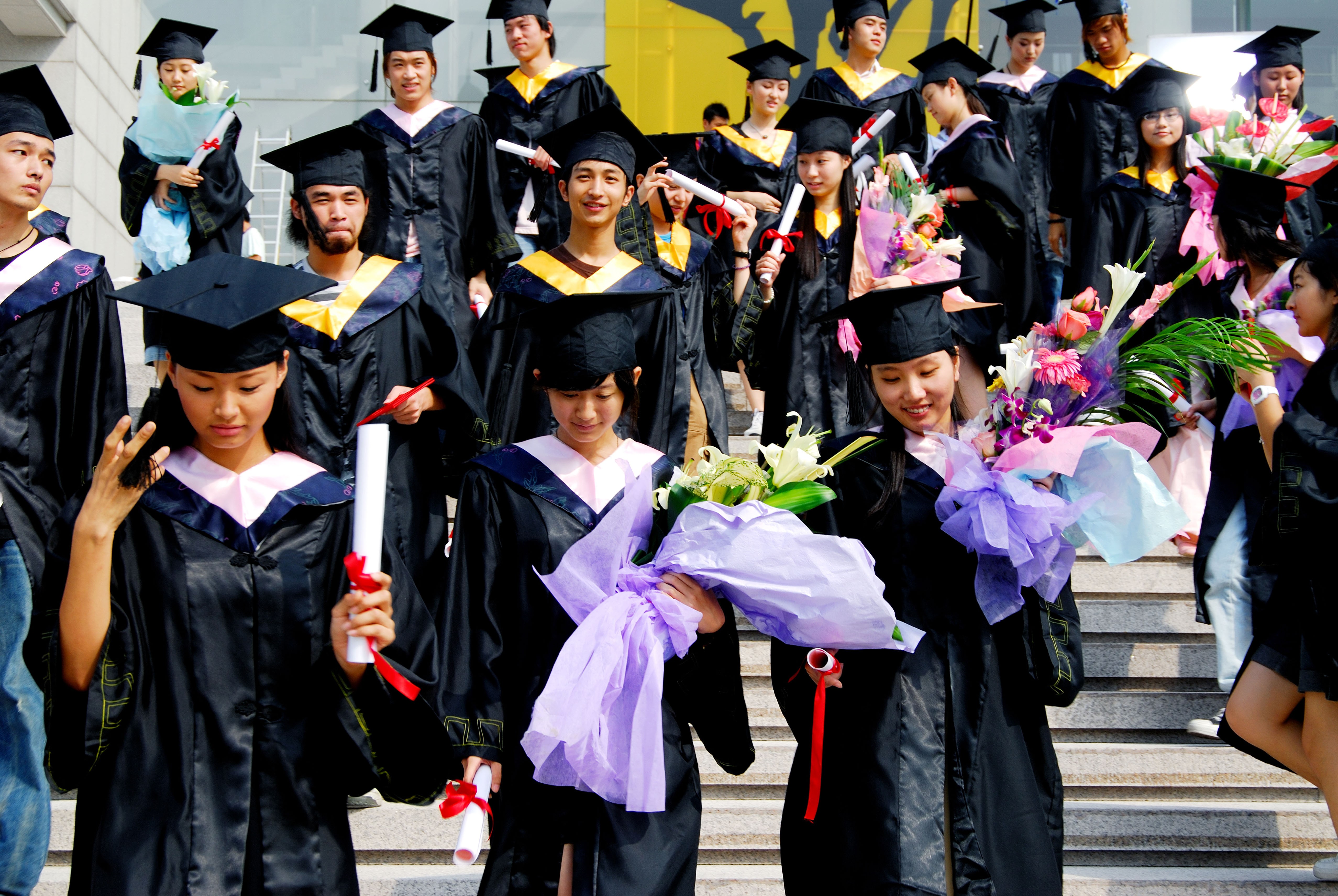 Women graduate from a university in Shanghai. The pursuit of education, and the unwillingness of Chinese men to wed women as educated as them, are among the reasons for a rise in the number of “leftover women” in China, author Roseann Lake argues in a new book. Photo: Alamy