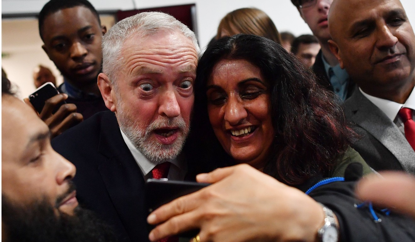 Bitish opposition Labour party leader Jeremy Corbyn poses for a selfie after giving a speech on Brexit at Coventry University in Coventry on Wednesday. Photo: AFP