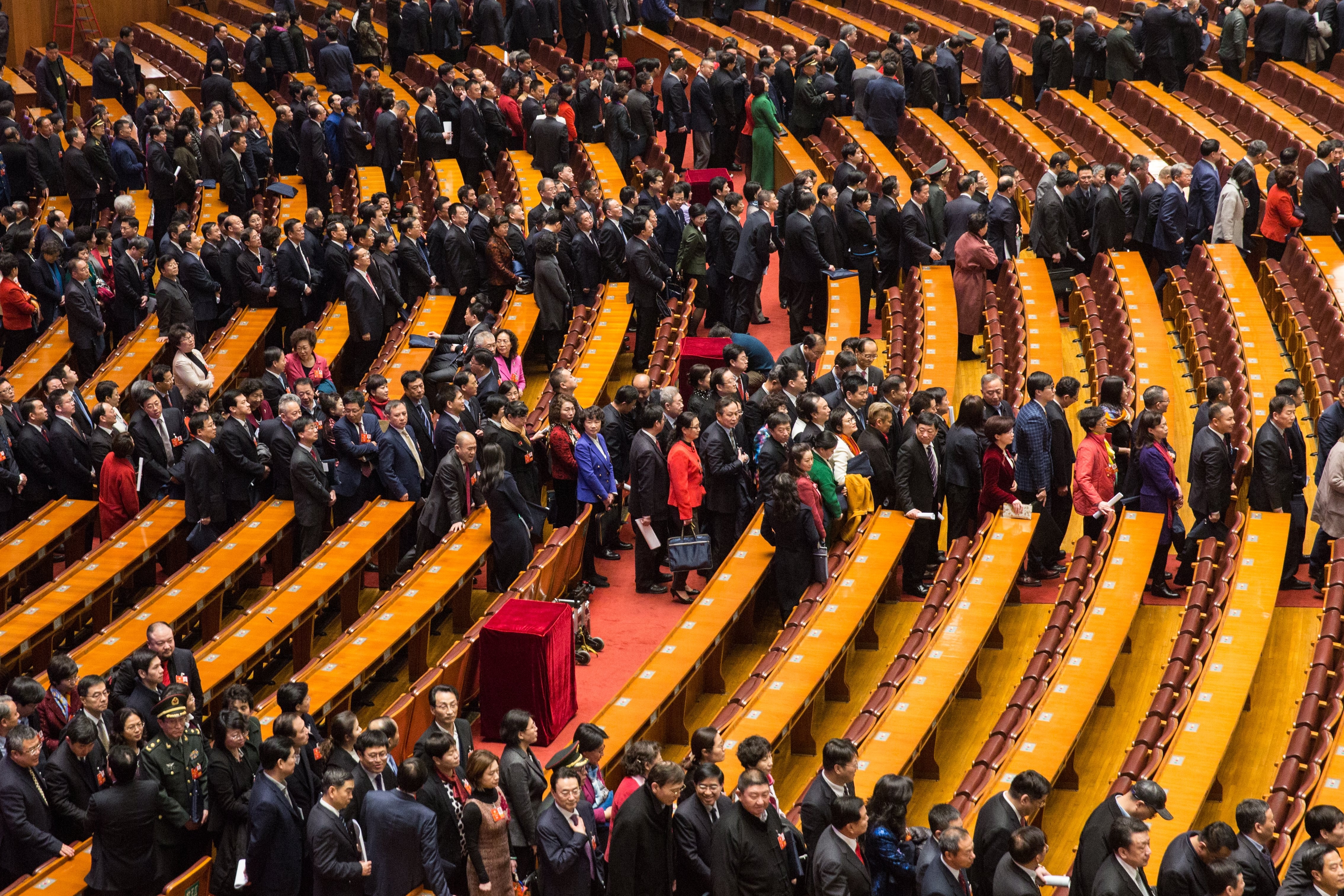 Delegates file out of the Great Hall of the People after the opening session of the CPPCC on Saturday. Photo: EPA-EFE