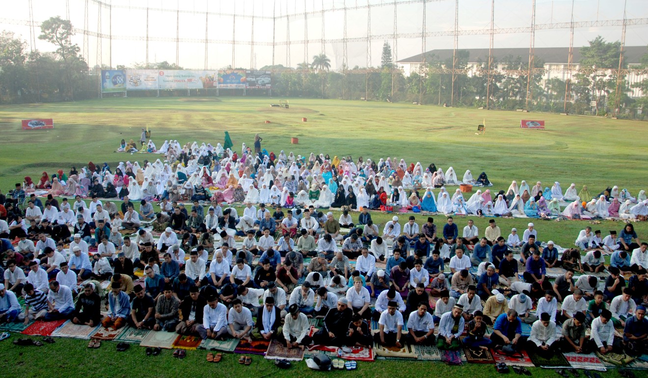 Muslims offer Eid al-Fitr prayers on a golf course in Bandung. Photo: AFP
