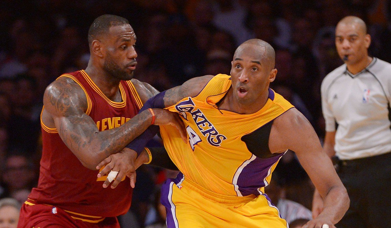 Kobe Bryant tussles with LeBron James during his playing days. Photo: USA Today Sports