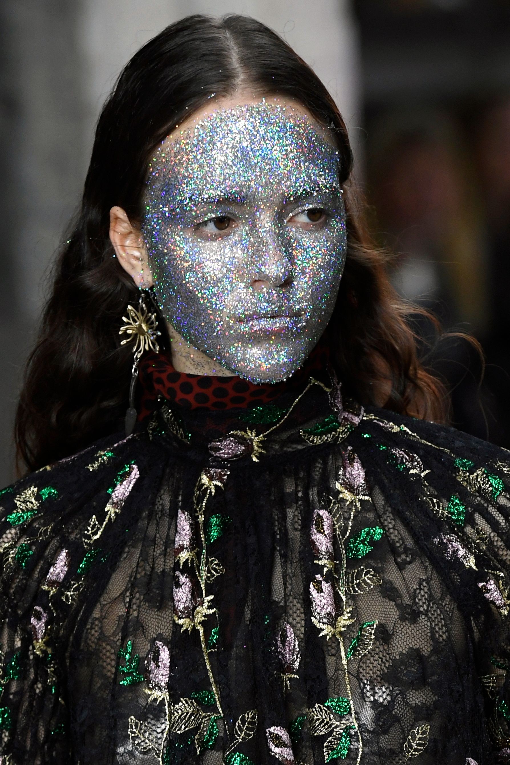 A model with glitter make-up presents a creation by Giambattista Valli at the 2018-2019 autumn winter collection show at Paris Fashion Week on Monday. Photo: AFP