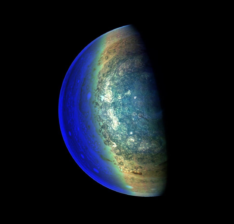This NASA image released March 2, 2018 captures the swirling cloud formations around the south pole of Jupiteras capturd by the Juno spacecraft in this color-enhanced image taken on February 7. Photo: AFP