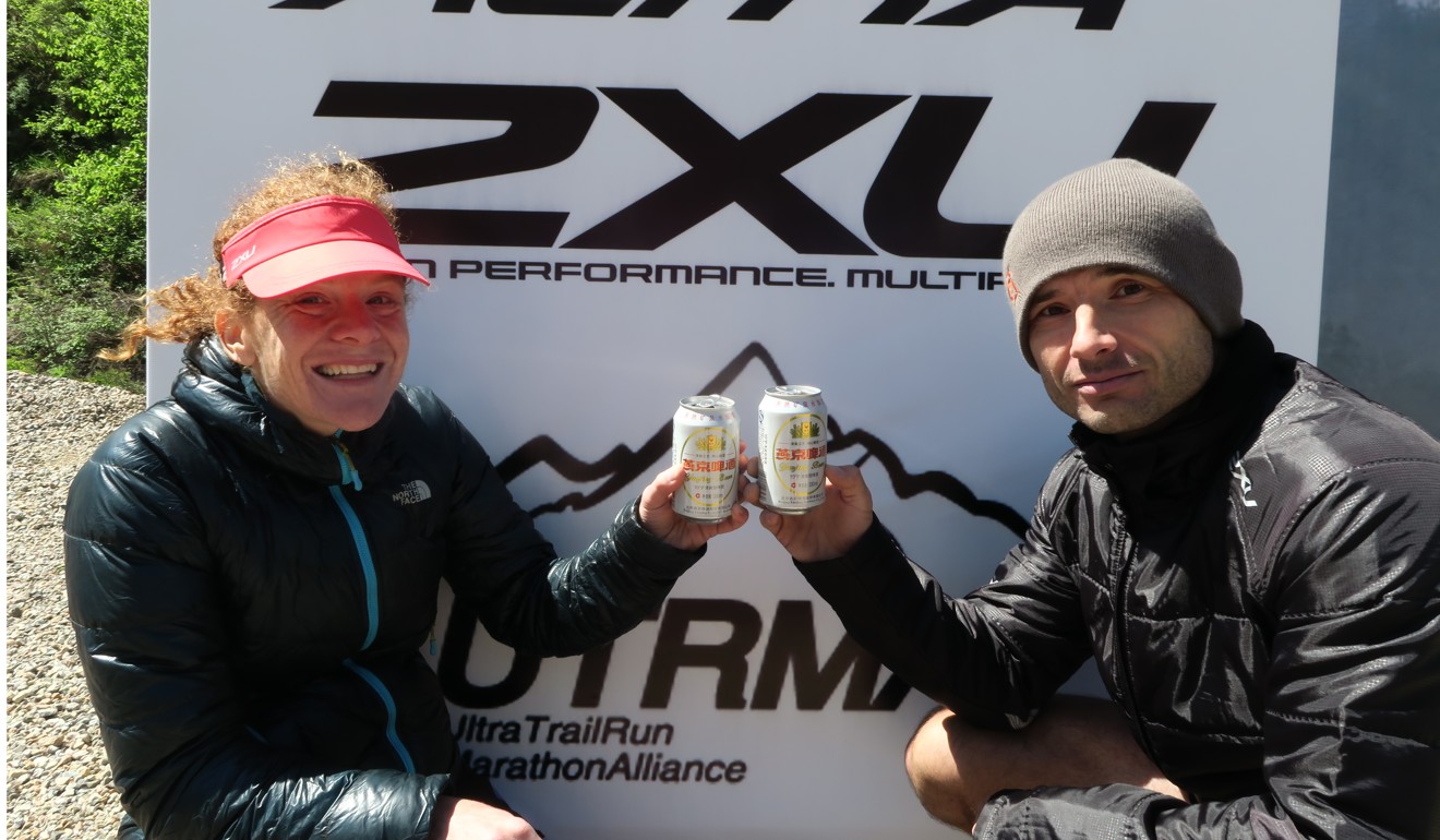 Kimball and fellow runner Pavel Toropov celebrating their wins in the Conquer the Wall half marathon near Beijing in 2016. Photo: Pavel Toropov