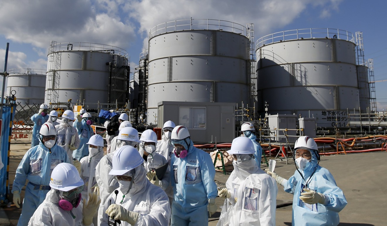 Tepco employees give members of the media a tour of the Fukushima Daiichi nuclear power plant. Photo: Reuters