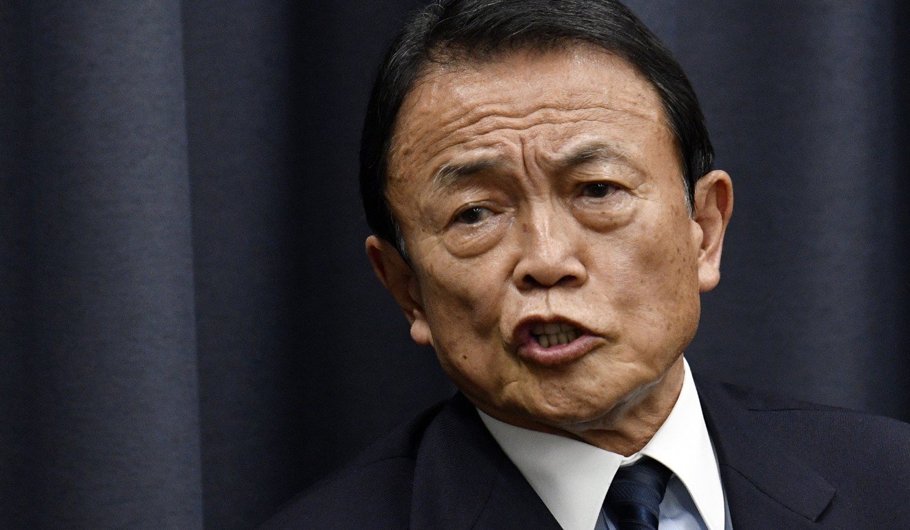 Japan's Finance Minister Taro Aso is likely to face mounting pressure to resign after his ministry admits to altering land sale documents. Photo: EPA