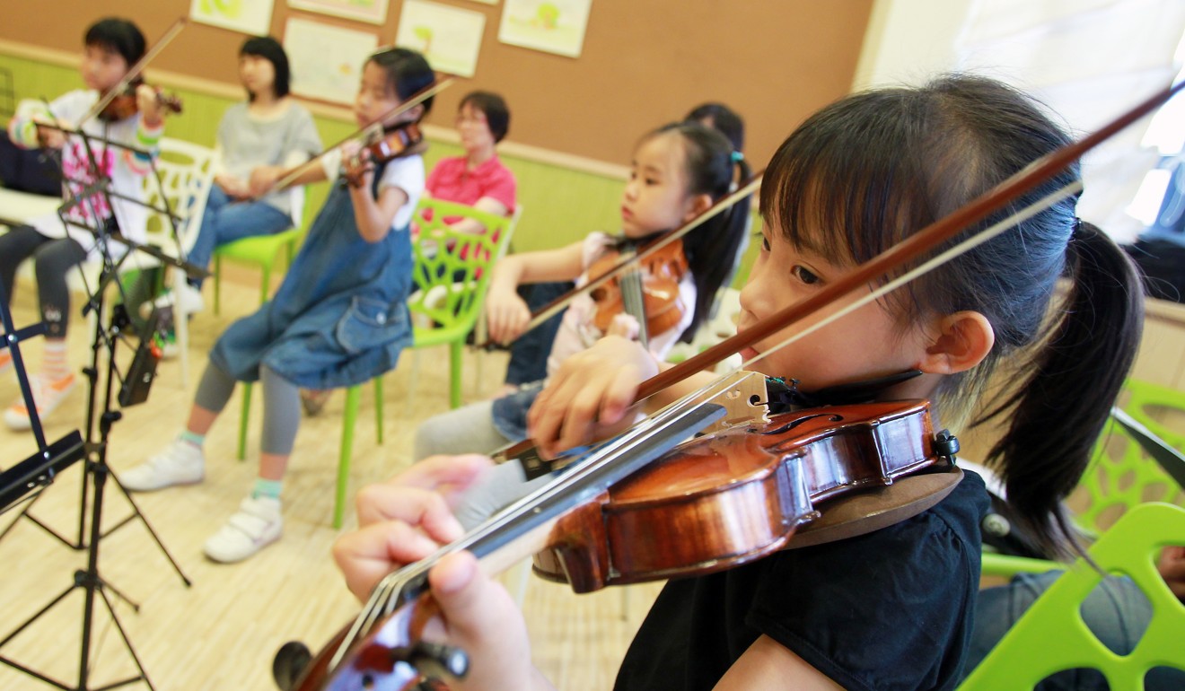 Children can learn to play a musical instrument when they have developed sufficient physical dexterity and attention span for lessons. Photo: Jonathan Wong/SCMP