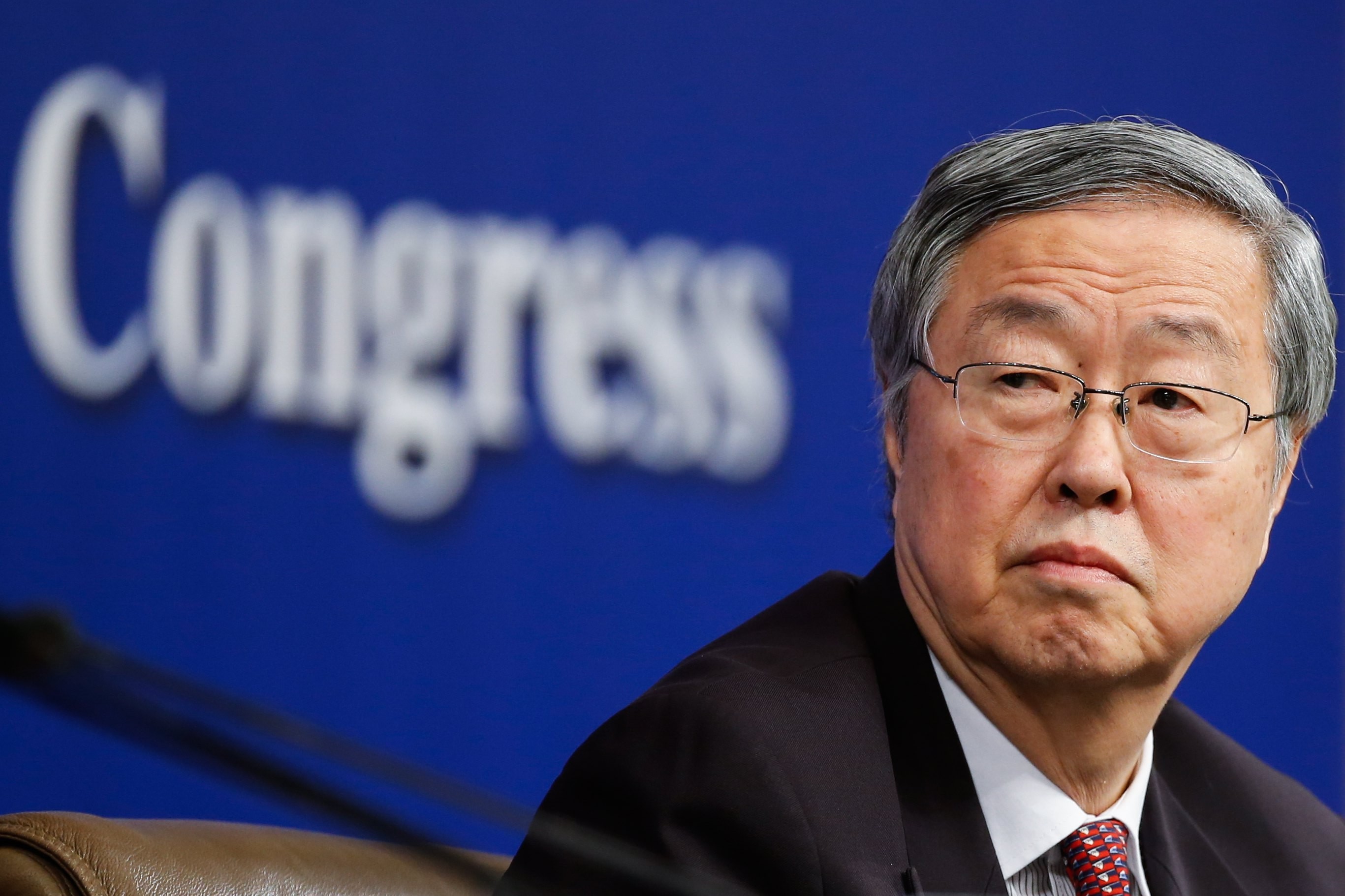 Zhou Xiaochuan, governor of the People's Bank of China, is urging China to be bolder in embracing foreign competition. Photo: EPA