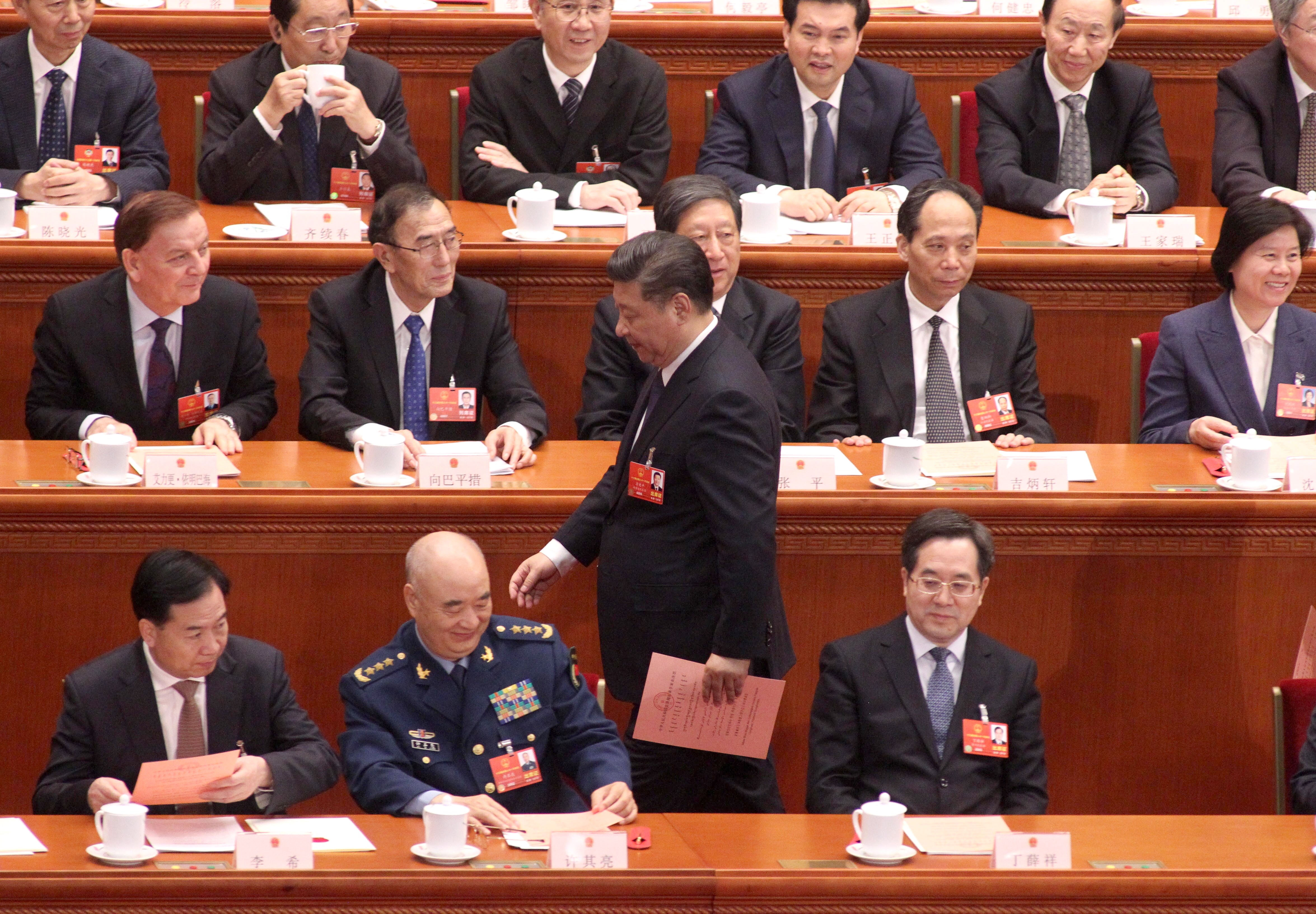 China’s National People’s Congress delegates voted overwhelmingly in favour of a change to the country’s constitution that enables Xi Jinping (standing) to remain president beyond 2023. Photo: Simon Song