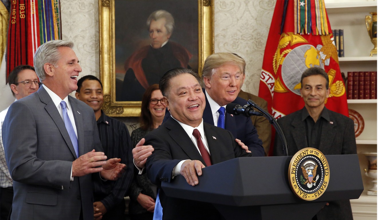 US President Donald Trump hugged Broadcom CEO Hock Tan as Tan announced the repatriation of his company to the US during a ceremony in the White House on November 2. Photo: TNS
