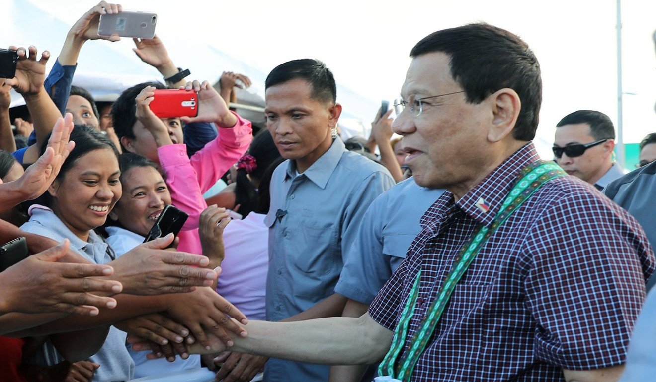 Philippine President Rodrigo Duterte greeting supporters in Lal-lo, Cagayan province, Philippines. Photo: EPA