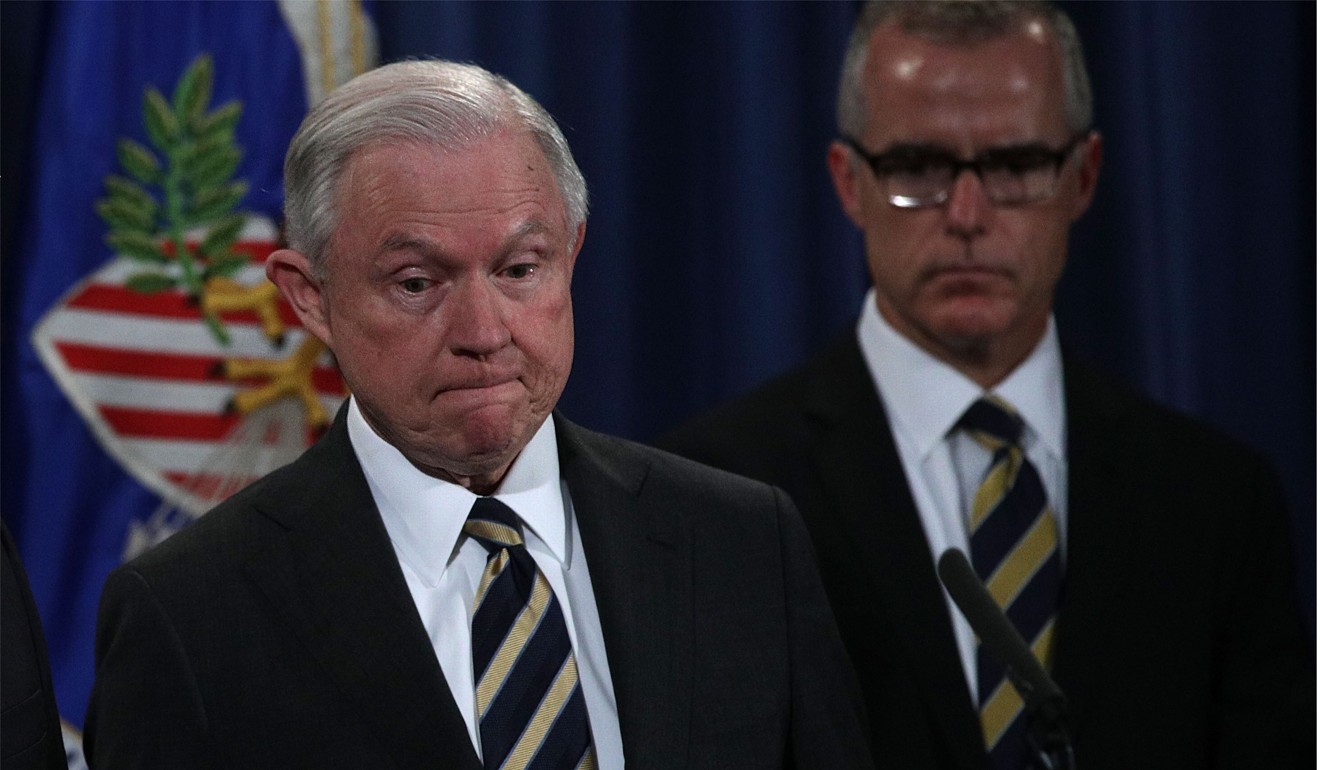 US Attorney General Jeff Sessions (seen on July 12, 2017 standing in front of then-Acting FBI Director Andrew McCabe) fired McCabe on Friday night. Photo: AFP