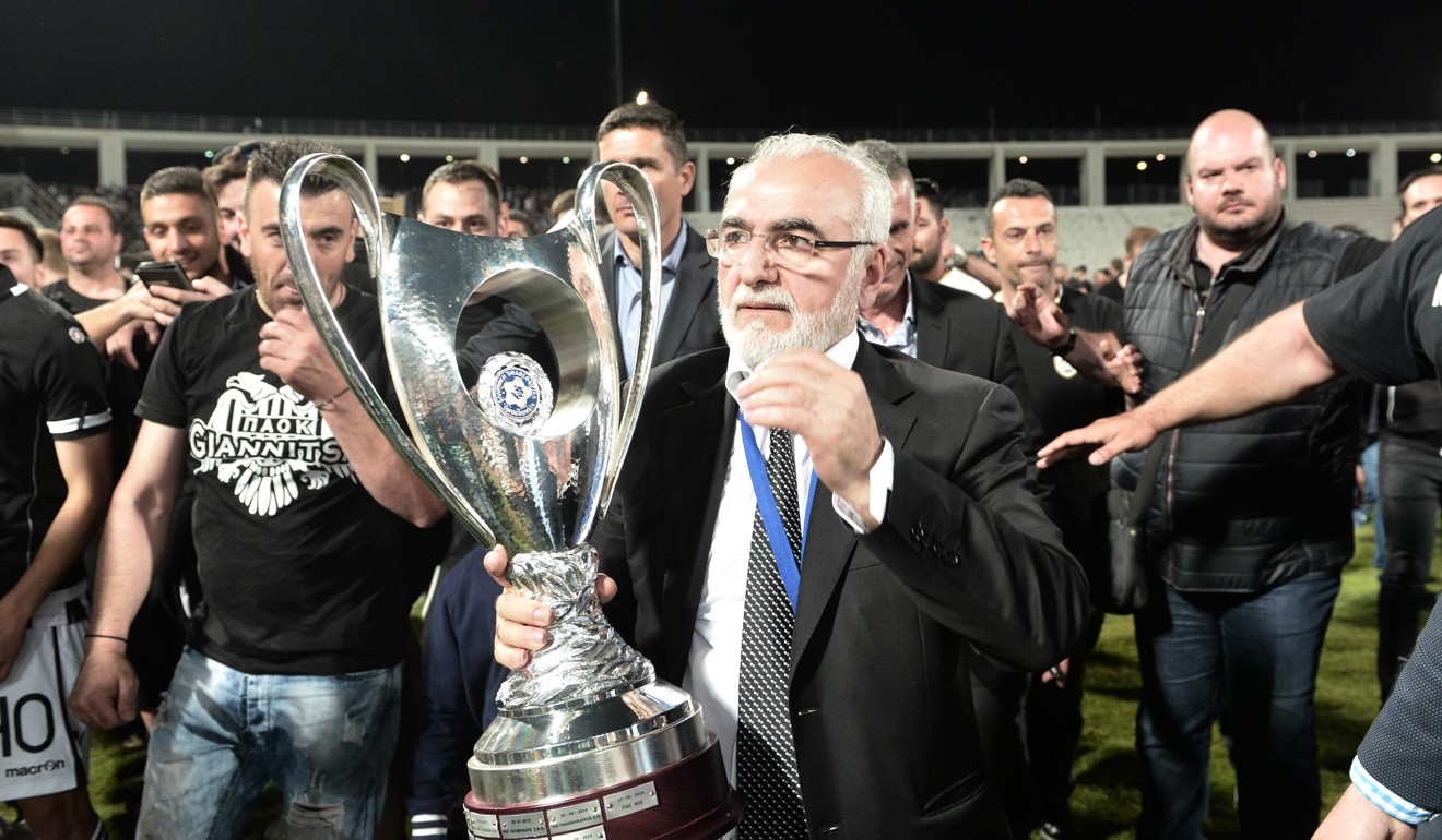 A picture taken on May 6, 2017, shows PAOK's Greek-Russian president Ivan Savvidis holding the trophy after the cup-final match between PAOK Thessaloniki and AEK Athens in Volos. Photo: Agence France-Presse