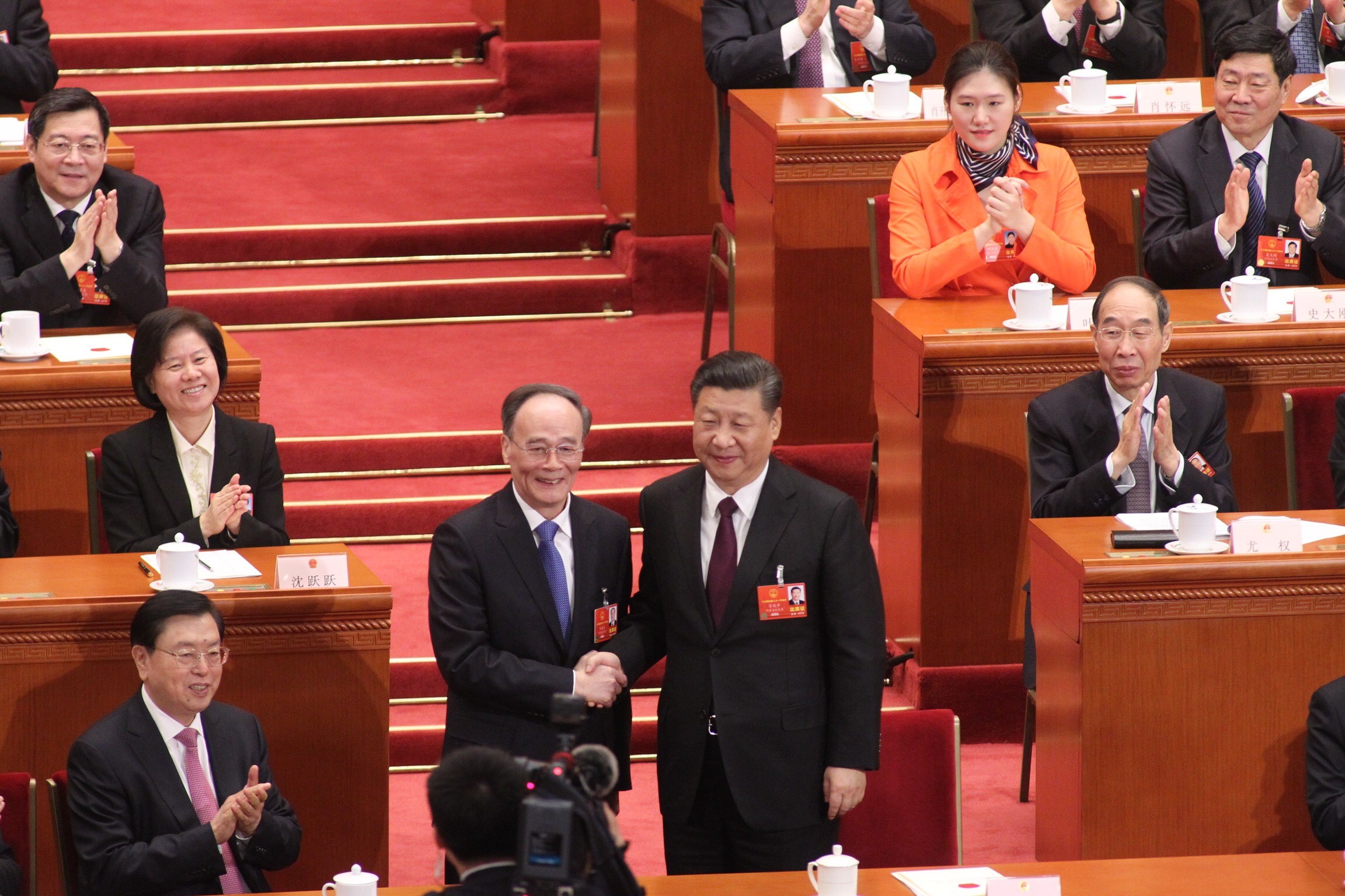 Wang Qishan (left) shakes hands with President Xi Jinping after being voted in as China’s new vice-president. Photo: Simon Song