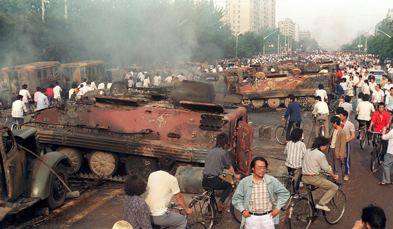 Armoured personnel carriers burnt by demonstrators to prevent the troops moving into Tiananmen Square on June 4, 1989. File photo