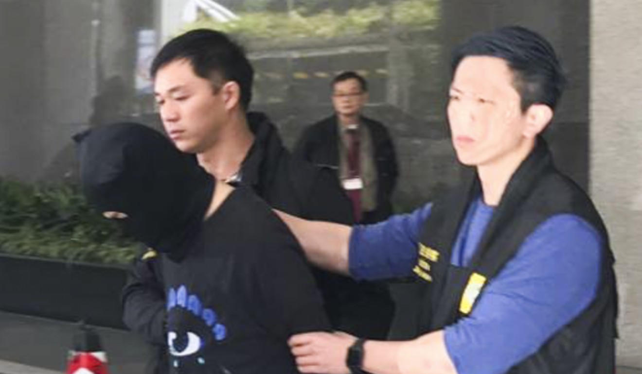 One of the three Hong Kong suspects with Macau police. Photo: Handout