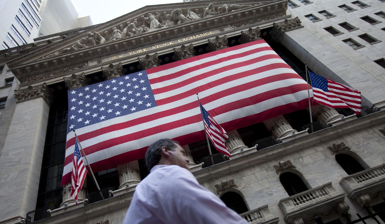 In this August 8, 2011 file photo, a pedestrian walks past the New York Stock Exchange in New York. Photo: AP