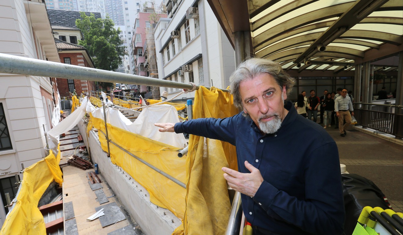 Paul Zimmerman points to the footbridge being built for the former Central Police Station compound. Photo: Dickson Lee