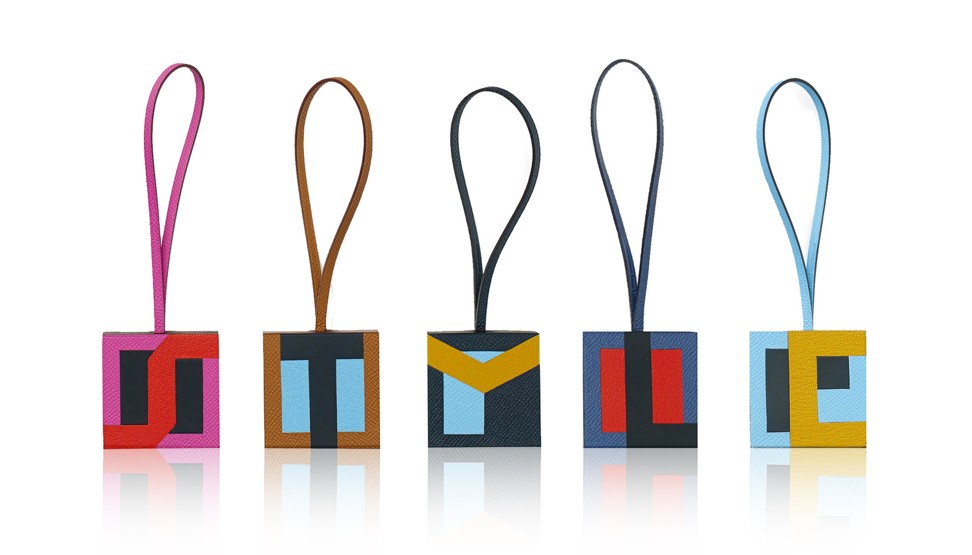 Hermès’ Lettres au carré bag charms spelling out ‘STYLE’ in Epsom calfskin, Sombrero calfskin and Mysore goatskin 
