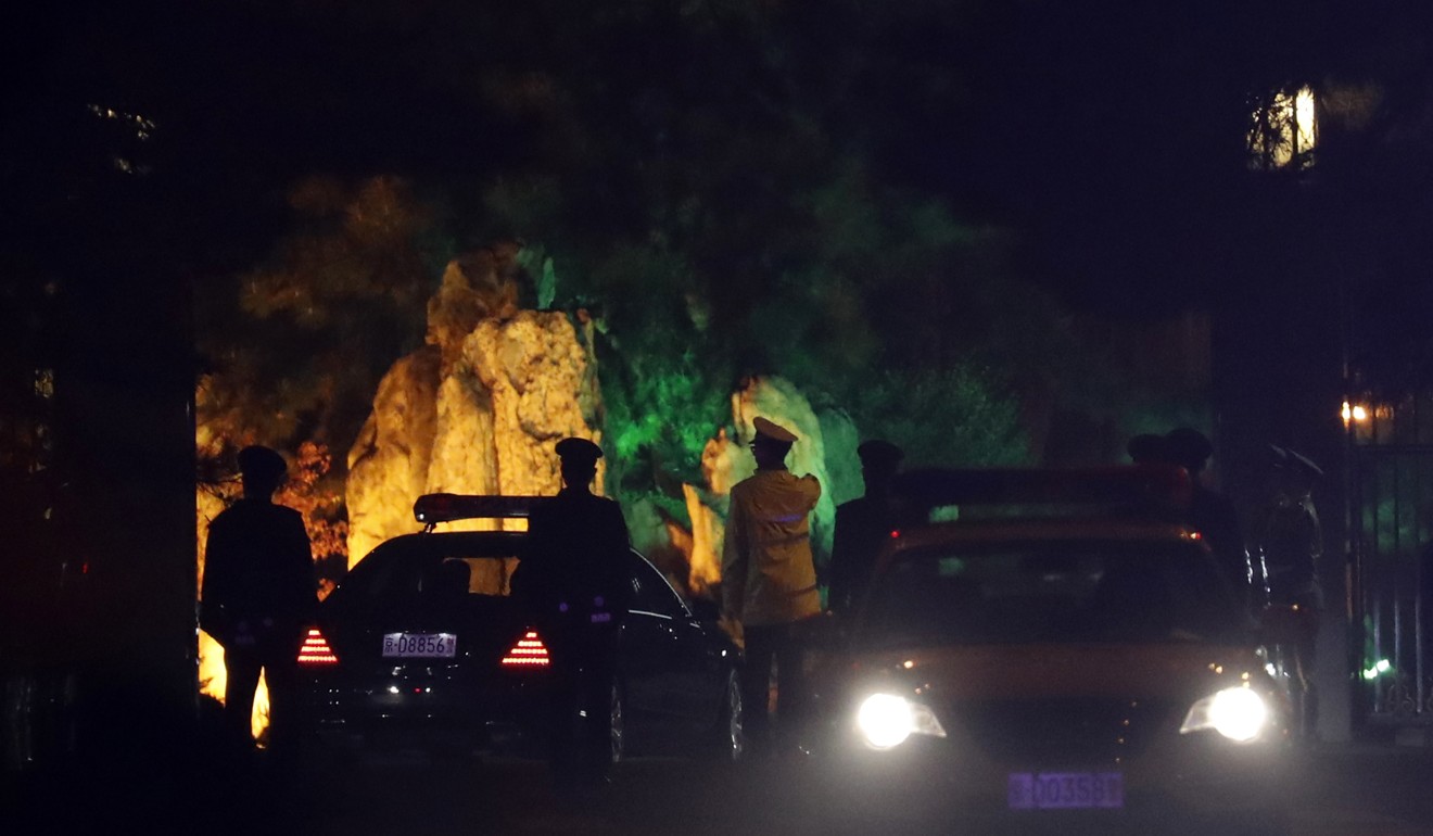 A convoy under heavy security is seen passing into the Diaoyutai State Guesthouse, where foreign dignitaries usually stay - and where Kim is believed to be residing, in Beijing on Monday. Photo: AP
