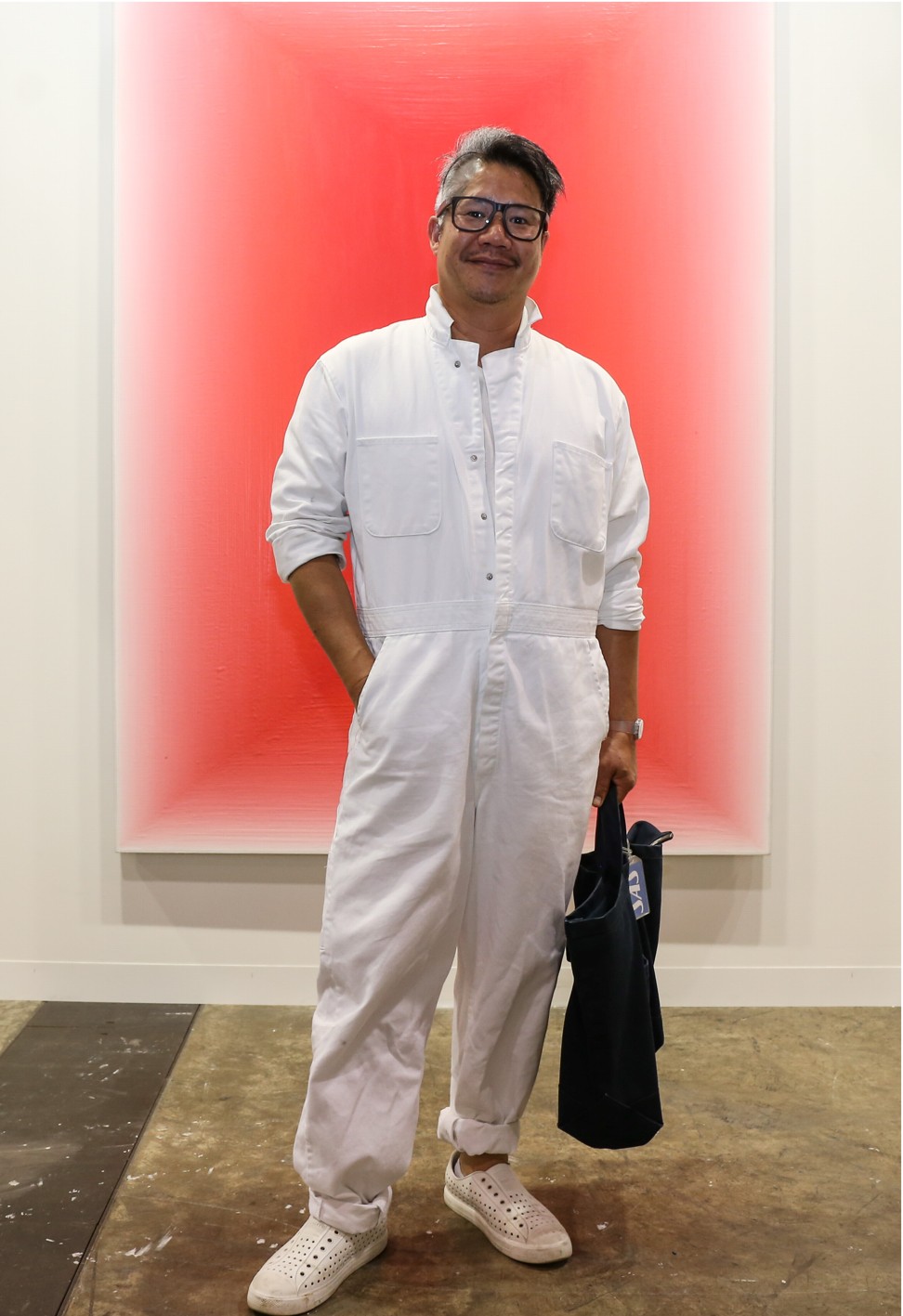 A visitor to Art Basel in a white boiler suit. Photo: Rachel Cheung