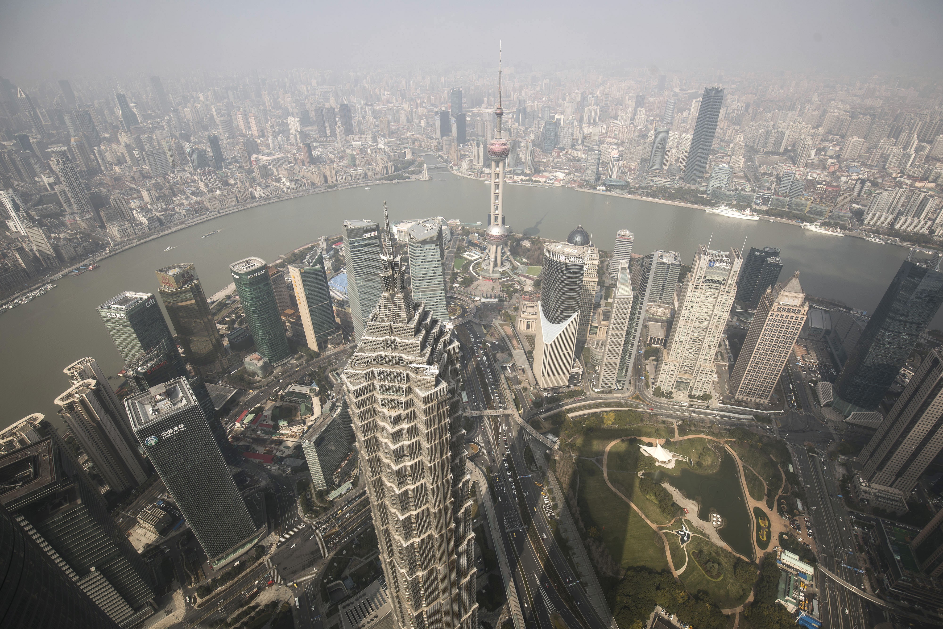 The city as seen from the Shanghai World Financial Centre. The study by BCG says 23 per cent of the jobs in China’s banking, insurance and securities sectors will be affected. It also says AI will improve the efficiency of the remaining employees by 38 per cent. Photo: Bloomberg