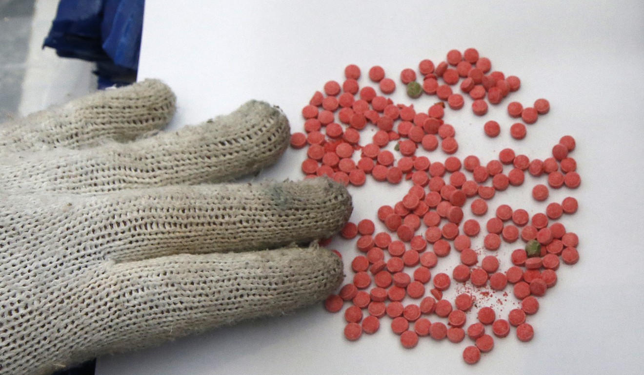 Police display amphetamine pills during a press conference in Bangkok. Photo: AP