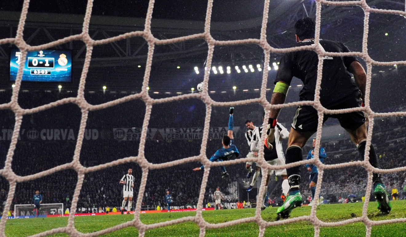 juventus goalkeeper Gianluigi Buffon watches on helpless as Ronaldo scores his second. Photo: Reuters