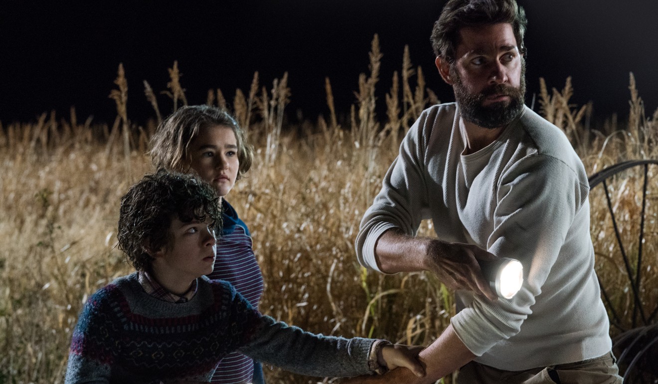 From left: Noah Jupe, Millicent Simmonds and John Krasinski in a still from A Quiet Place.