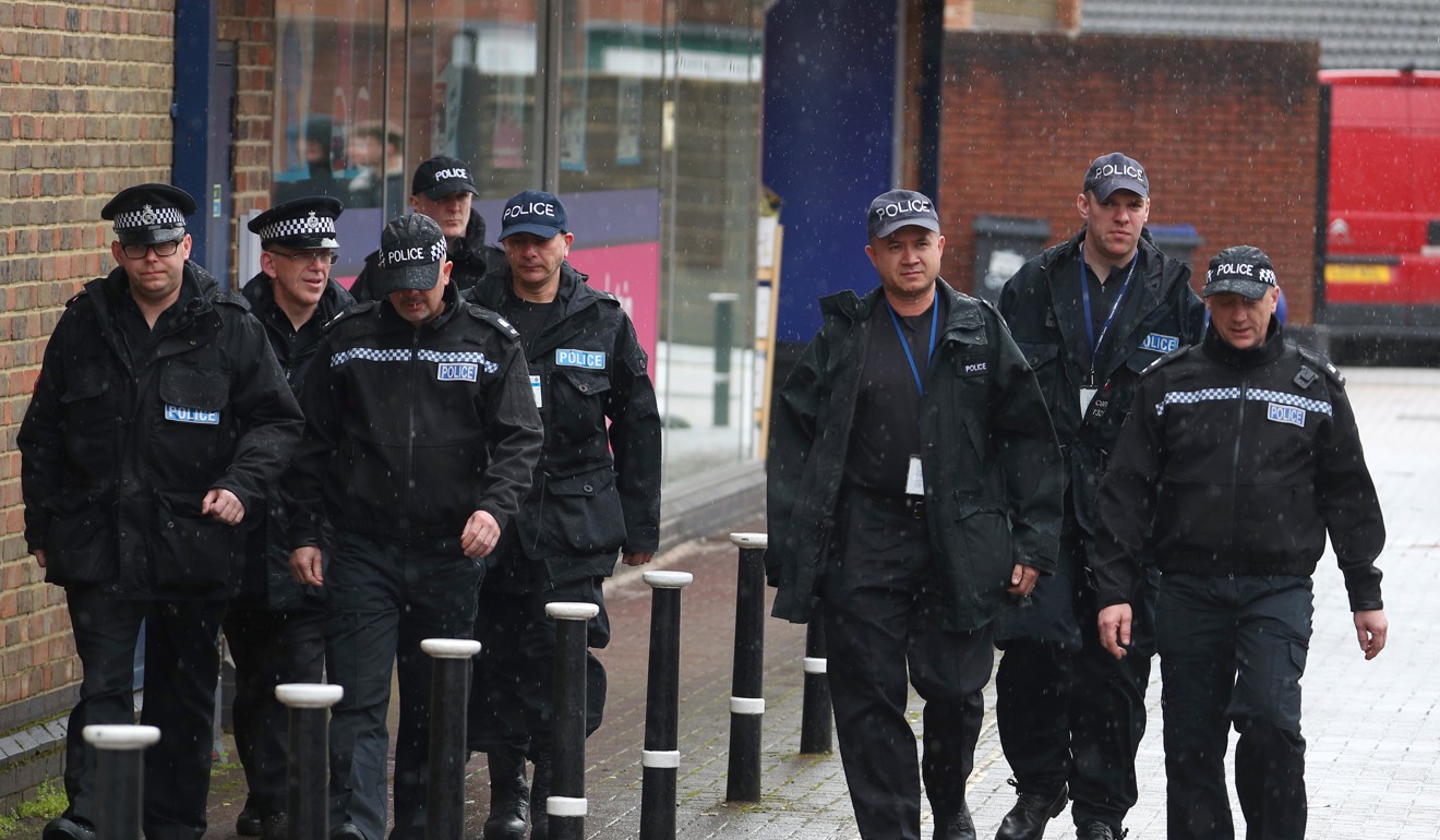 Police officers walk through the city centre, near where former Russian intelligence officer Sergei Skripal and his daughter Yulia were found poisoned, in Salisbury. Photo: Reuters