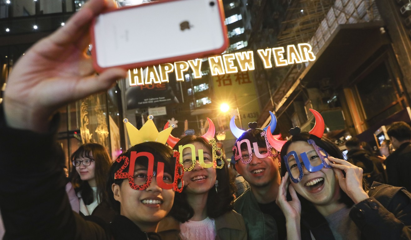 Revellers at Lan Kwai Fong counting down to the New Year on December 31, 2018. Photo: Sam Tsang