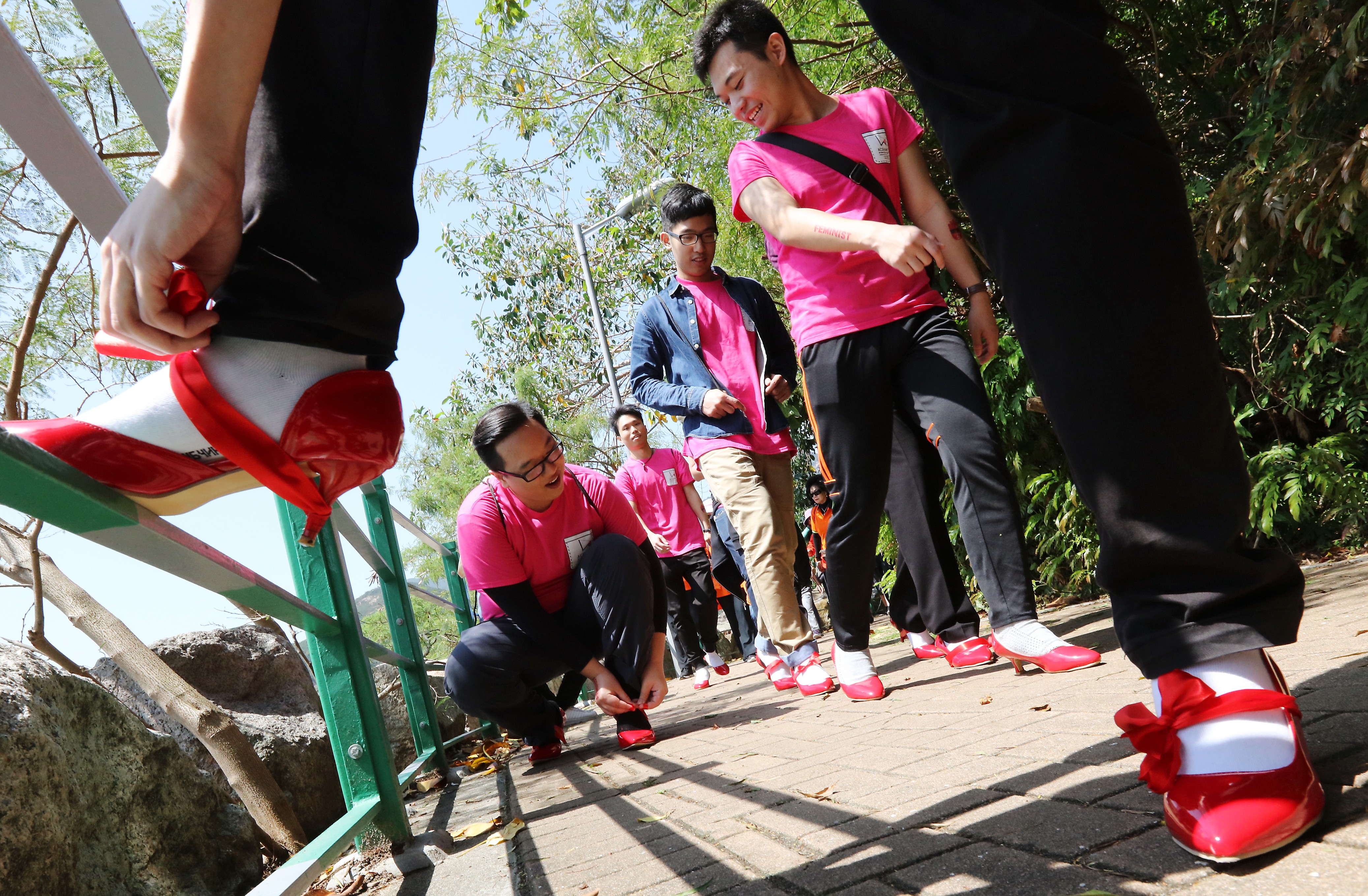Men wear high heels to experience life as women in the Walk in Her Shoes charity event from Deep Water Bay to Seaview Promenade, in Hong Kong, in April 2017. Photo: Felix Wong